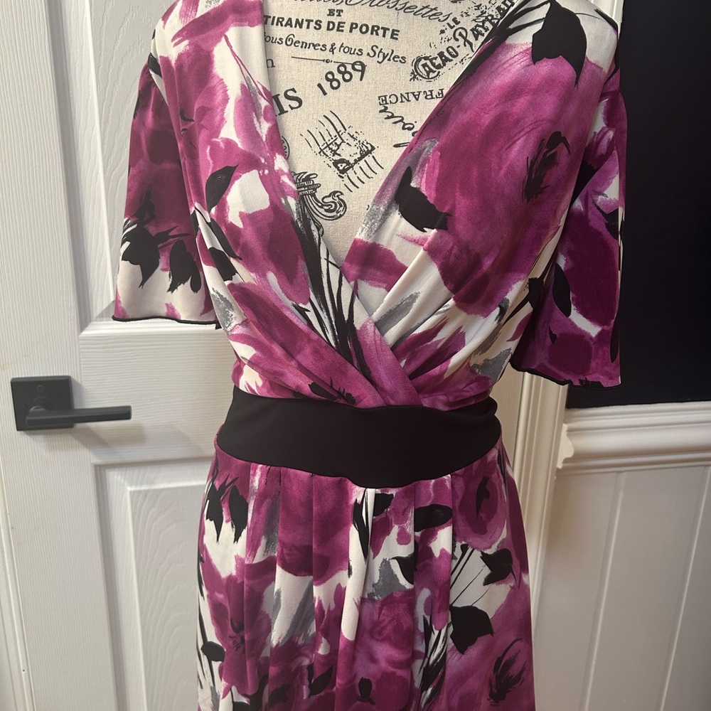 Cato Purple and Black Floral Wrap Top. 
Cute top . Ties in the back .